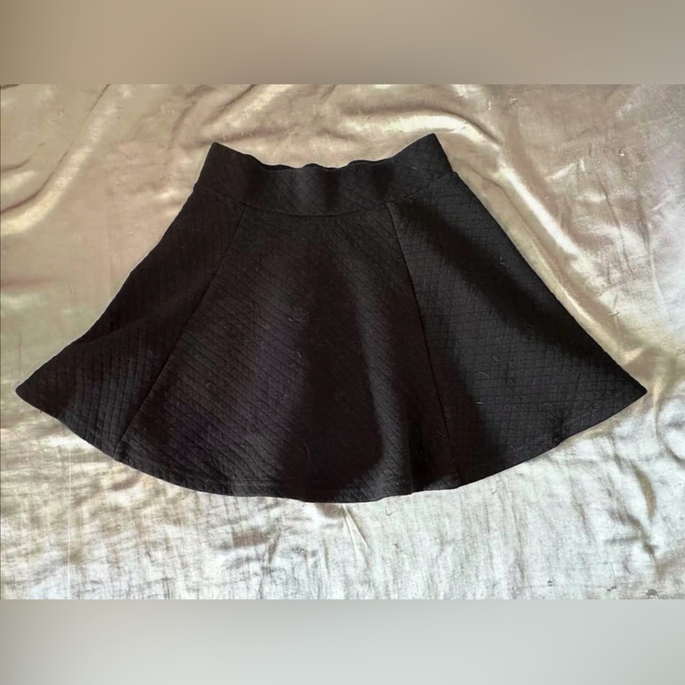 short high-waisted black zip-up skirt